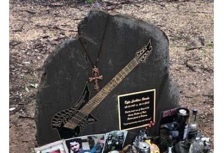 Bronze Guitar set in stone