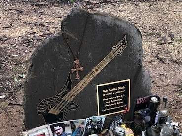 Bronze Guitar set in stone